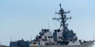 guided-missile destroyer cruising on calm sea