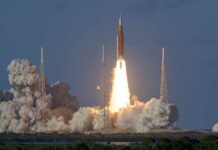 Musk’s $100B Spaceport Shocks Louisiana Rocket launching from a coastal pad at dawn with bright exhaust plume