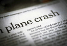 Newspaper headline about a plane crash.