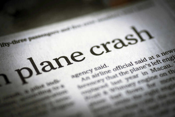 shutterstock_290501621 Newspaper headline about a plane crash.