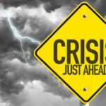 Bulldozers Hit Big Bend — Then Chaos Yellow sign reading Crisis Just Ahead with stormy sky