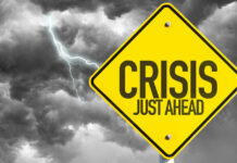 Bulldozers Hit Big Bend — Then Chaos Yellow sign reading Crisis Just Ahead with stormy sky