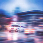 Lightning Rips Prison Yard — Chaos Erupts Ambulance speeding through city street at night