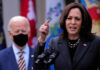 Kamala Caught Faking It?! Kamala Harris speaking at podium with Joe Biden in background