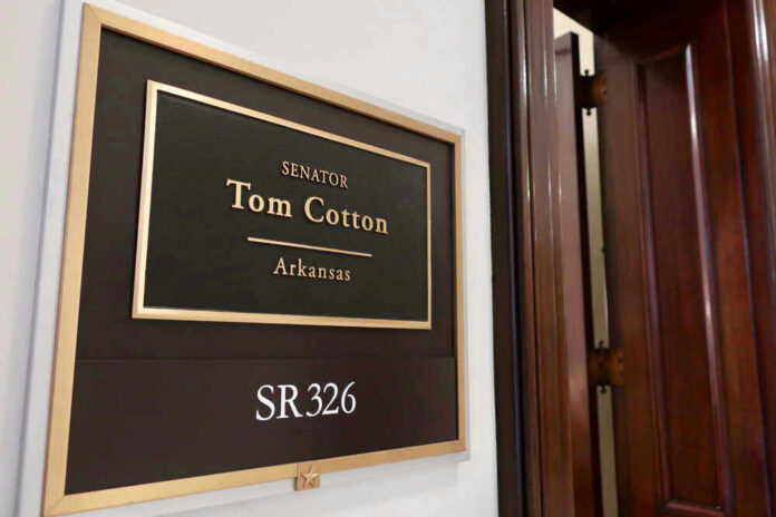 Senator Tom Cotton office sign on wall.