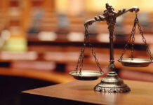Murder Case CRACKED — Mastermind Nailed Scales of justice in an empty courtroom.