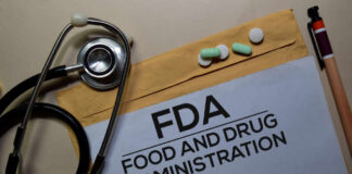 Stethoscope and medication on a folder labeled FDA