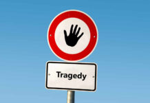 Campus Tragedy: 2 Dead From WHAT? Road sign with hand stop symbol and a lower sign reading Tragedy