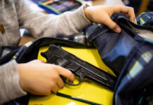 Toddler Pulls Loaded Gun WHERE?! Kid placing handgun inside a backpack on desk