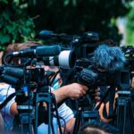 Bronco Filson: The ULTIMATE Off-Road Upgrade? TV news cameras crowding together at an outdoor event