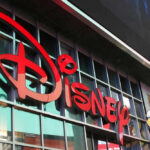 Disney sign on building with Mickey Mouse figure
