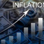 A visual representation of inflation with dollar bills and a rising graph