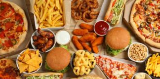 Assorted fast food including burgers, pizza, fries, and snacks