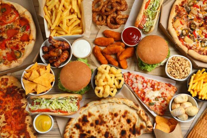 Assorted fast food including burgers, pizza, fries, and snacks