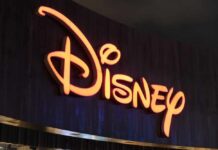 Disney Gets More Bad News Illuminated Disney logo against a dark background
