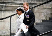 Royal Door Slammed — Now What? A man and woman walking down outdoor stairs smiling.