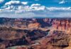 Remains Surface Amid Grand Canyon Search A panoramic view of the Grand Canyon with a river winding through the landscape