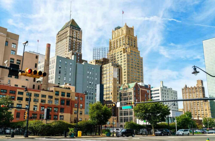Cityscape with historic high-rise buildings and traffic lights.