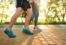 Death Risk PLUNGES With Fewer Steps Two individuals walking on a path during sunset