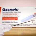 Governor’s GLP-1 Shot Stuns Beltway Ozempic injection pen with a droplet at the needle tip