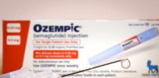 Ozempic injection pen with a droplet at the needle tip