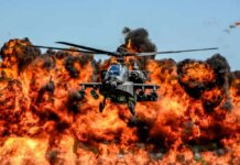 Arson Wave Hits Vacation Paradise? Attack helicopter flying in front of a massive explosion