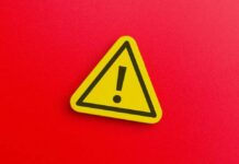 Red State Governor Declares Statewide Disaster Yellow warning sign with exclamation mark on red background