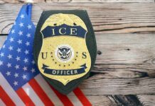 ICE officer badge displayed next to the U.S. flag
