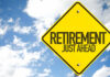 Early Retirement’s NASTY Surprise? A yellow road sign indicating retirement is just ahead