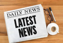 Cindy Crawford Suffers Horrible Tragedy Newspaper with headline latest news on table
