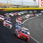 Racing Legend’s Health Shocks NASCAR Fans Race cars on a track in formation driving fast