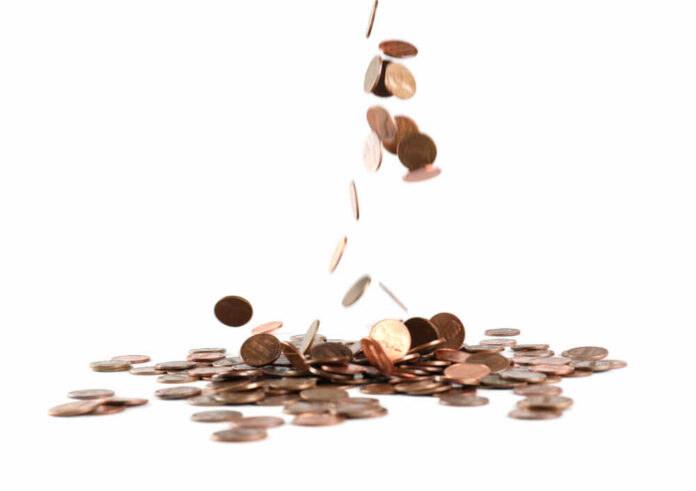 Coins,Falling,Down,Into,Pile,Isolated,On,White
