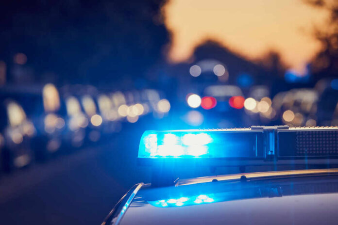 Siren,Light,On,Roof,Of,Police,Car,At,Street.,Themes police car light bar flashing on a city street at dusk