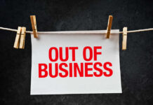 Freight Meltdown: Carriers Vanish paper sign with red lettering clipped to a clothesline