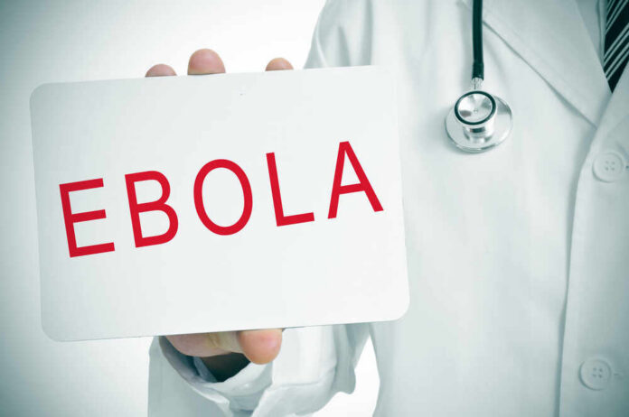 A,Doctor,Showing,A,Signboard,With,The,Word,Ebola,Written Doctor holding a sign about Ebola