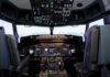 Interior view of an airplane cockpit with various instruments and controls