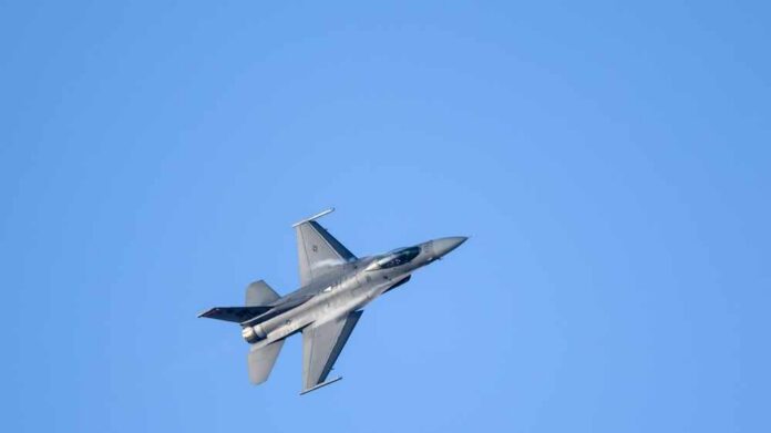 Sakhir,Airbase,,Manama,bahrain,-,Nov-09,-,2022:,Flying,Display,And A commercial airplane flying above two military jets in a clear blue sky