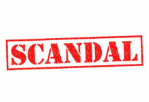 Racist Text Scandal Rips Police Dept Red stamp with the word scandal