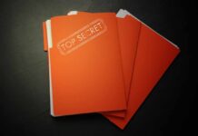 Secret Files: Saudi Link Bombshell? A stack of orange folders labeled 'TOP SECRET' on a dark surface