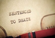 Botched Execution Sparks Chaos Close-up of a typewritten document stating 'SENTENCED TO DEATH'