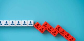 White and red blocks with person icons arranged in a falling domino pattern