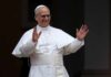 Pope Scare: Surgery This Week Clergyman in white robes raising both hands