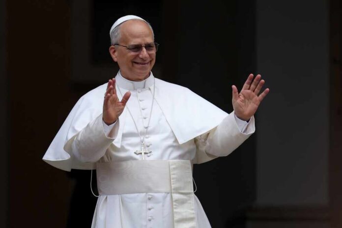 Clergyman in white robes raising both hands