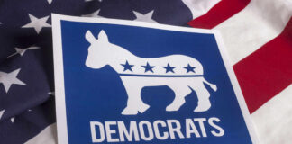 Democrats logo on American flag background.