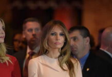 Melania Forces Russia’s Hand Melania Trump at an event with a crowd in the background